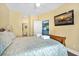 Bright bedroom showcasing an open doorway to a kitchen and ensuite bathroom at 216 W Arctic Ave # 9, Folly Beach, SC 29439