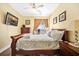 Comfortable bedroom with television, ceiling fan, and balcony access with water views at 216 W Arctic Ave # 9, Folly Beach, SC 29439