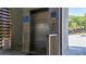 Exterior elevator access with safety signage and instructions for use at 216 W Arctic Ave # 9, Folly Beach, SC 29439