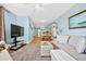 Open-concept living area seamlessly connects to the dining area, creating an inviting and connected living space at 216 W Arctic Ave # 9, Folly Beach, SC 29439