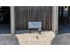 Signage for Seacoast Villas with a wooden fence and gravel ground covering at 216 W Arctic Ave # 9, Folly Beach, SC 29439