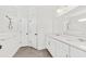 Bright bathroom featuring double vanity, white marble counters and tiled walk-in shower at 2200 Hamlin Sound Cir, Mount Pleasant, SC 29466