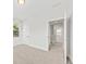 Bedroom features neutral carpet, a large window, and access to other rooms at 2200 Hamlin Sound Cir, Mount Pleasant, SC 29466