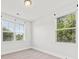 Bedroom with large windows, neutral color palette, and carpet flooring at 2200 Hamlin Sound Cir, Mount Pleasant, SC 29466