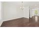 Bright dining space featuring hardwood floors, a chandelier, and access to other rooms at 2200 Hamlin Sound Cir, Mount Pleasant, SC 29466
