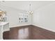 Elegant dining area showcasing hardwood floors, a chandelier, and natural light at 2200 Hamlin Sound Cir, Mount Pleasant, SC 29466