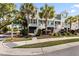 Charming townhomes boast a coastal aesthetic with palm trees and well-maintained landscaping at 2200 Hamlin Sound Cir, Mount Pleasant, SC 29466