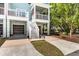 Exterior shot of the property showcasing the private garages and manicured landscaping at 2200 Hamlin Sound Cir, Mount Pleasant, SC 29466
