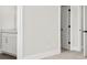 Bright hallway featuring doorways and a partial view of the bathroom vanity at 2200 Hamlin Sound Cir, Mount Pleasant, SC 29466
