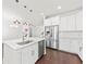 This open kitchen features stainless steel appliances, an island, and flows into the living area at 2200 Hamlin Sound Cir, Mount Pleasant, SC 29466