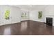 Comfortable living room with a fireplace, hardwood floors, and a door to the outdoor space at 2200 Hamlin Sound Cir, Mount Pleasant, SC 29466