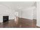 Inviting living room with a cozy fireplace, hardwood floors, and open layout at 2200 Hamlin Sound Cir, Mount Pleasant, SC 29466