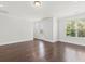 Spacious living room with hardwood floors, a door to the outside, and large windows at 2200 Hamlin Sound Cir, Mount Pleasant, SC 29466