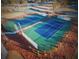 Aerial view of well-maintained tennis courts surrounded by manicured landscaping; perfect for active residents at 2200 Hamlin Sound Cir, Mount Pleasant, SC 29466