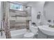 Updated bathroom with modern fixtures, stylish tile work, and a shower-tub combination at 2350 Kent Ave, North Charleston, SC 29405