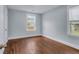 Cozy bedroom featuring hardwood floors, neutral paint, and bright windows at 2350 Kent Ave, North Charleston, SC 29405