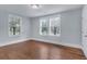 Bright bedroom with hardwood floors, neutral paint, and large windows, providing ample natural light at 2350 Kent Ave, North Charleston, SC 29405