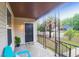 Inviting front porch with decorative railings and comfortable seating perfect for enjoying the outdoors at 2350 Kent Ave, North Charleston, SC 29405