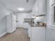 Contemporary kitchen featuring white cabinets, tile flooring, granite counters, and new appliances at 2350 Kent Ave, North Charleston, SC 29405