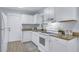 Well-equipped kitchen with white cabinets, stainless steel appliances, granite countertops, and tile flooring at 2350 Kent Ave, North Charleston, SC 29405