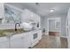 Bright kitchen with white cabinets, granite countertops, stainless steel appliances, and tile flooring at 2350 Kent Ave, North Charleston, SC 29405