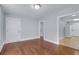 Spacious living room featuring hardwood floors, modern lighting, and fresh paint throughout the space at 2350 Kent Ave, North Charleston, SC 29405