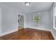 Bright living room with hardwood floors, neutral paint, and windows to allow for an abundance of natural light at 2350 Kent Ave, North Charleston, SC 29405