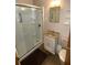 Bathroom with glass-enclosed shower, vanity, and modern fixtures at 2401 Palmetto Blvd, Edisto Island, SC 29438