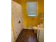 Bathroom featuring a shower with curtain, yellow walls, and a vintage-style sink at 2401 Palmetto Blvd, Edisto Island, SC 29438