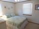 Inviting bedroom features bright bedding and a window for natural light at 2401 Palmetto Blvd, Edisto Island, SC 29438