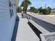 Inviting outdoor deck with built-in benches overlooking the street and scenic palm trees at 2401 Palmetto Blvd, Edisto Island, SC 29438
