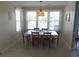 Bright dining area featuring a classic chandelier and large windows for lots of natural light at 2401 Palmetto Blvd, Edisto Island, SC 29438