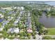 Aerial view of a beautiful neighborhood with tree-lined streets and scenic lake views at 2449 Daniel Island Dr, Daniel Island, SC 29492