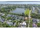 An aerial view shows a neighborhood, a lake, golf course and waterway at 2449 Daniel Island Dr, Daniel Island, SC 29492