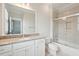 Bright bathroom with granite countertops, tile floor, tiled shower with glass door, and large mirror at 2449 Daniel Island Dr, Daniel Island, SC 29492