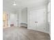 Bedroom featuring plush carpet, neutral decor, a ceiling fan, built in shelving, and access to bathroom at 2449 Daniel Island Dr, Daniel Island, SC 29492