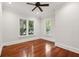 Bright bedroom with rich hardwood floors, neutral walls, and large windows offering lovely outdoor views at 2449 Daniel Island Dr, Daniel Island, SC 29492