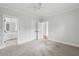 Neutral bedroom with carpet floor, white trim, and a ceiling fan with an entrance to the bathroom and hallway at 2449 Daniel Island Dr, Daniel Island, SC 29492