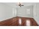 An empty bedroom showcasing hardwood floors and natural light at 2449 Daniel Island Dr, Daniel Island, SC 29492