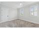 Bedroom with ceiling fan, neutral color palette, two shuttered windows allowing for lots of natural light at 2449 Daniel Island Dr, Daniel Island, SC 29492
