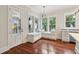 Charming breakfast nook with custom bench seating, natural light, and a door to an outdoor porch at 2449 Daniel Island Dr, Daniel Island, SC 29492