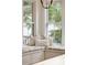 Inviting breakfast nook features a built-in bench with plush cushions and sun-filled windows at 2449 Daniel Island Dr, Daniel Island, SC 29492