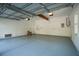 Large garage with white walls, concrete floor, and a door to the outside at 2449 Daniel Island Dr, Daniel Island, SC 29492