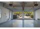 Spacious garage with concrete floor and two overhead doors leading to the driveway at 2449 Daniel Island Dr, Daniel Island, SC 29492