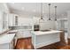A stunning gourmet kitchen boasting custom cabinets, stainless appliances, and a center island with cooktop at 2449 Daniel Island Dr, Daniel Island, SC 29492