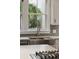 Gourmet kitchen features a stainless steel sink and a view of a vibrant backyard through a bright window at 2449 Daniel Island Dr, Daniel Island, SC 29492