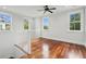 Bright loft space with gleaming hardwood floors, complemented by natural light streaming through multiple windows at 2449 Daniel Island Dr, Daniel Island, SC 29492