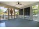 Screened porch with overhead fan, outdoor furniture and view of trees and homes at 2449 Daniel Island Dr, Daniel Island, SC 29492