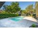 Private swimming pool surrounded by lush greenery, perfect for relaxation and recreation in the backyard at 2449 Daniel Island Dr, Daniel Island, SC 29492