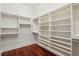 Large walk-in closet with custom shelving for optimized storage and organization at 2449 Daniel Island Dr, Daniel Island, SC 29492
